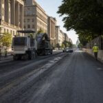 AI-generated editorial image of Pennsylvania Avenue being prepared for the Freedom 250 IndyCar race in Washington DC