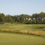 AI-generated editorial concept of Reston National Golf Course with proposed stacked townhomes and a driving range; final design may differ