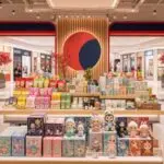 DC Spot editorial illustration of a colorful Asian lifestyle store with snacks beauty products home goods and collectibles