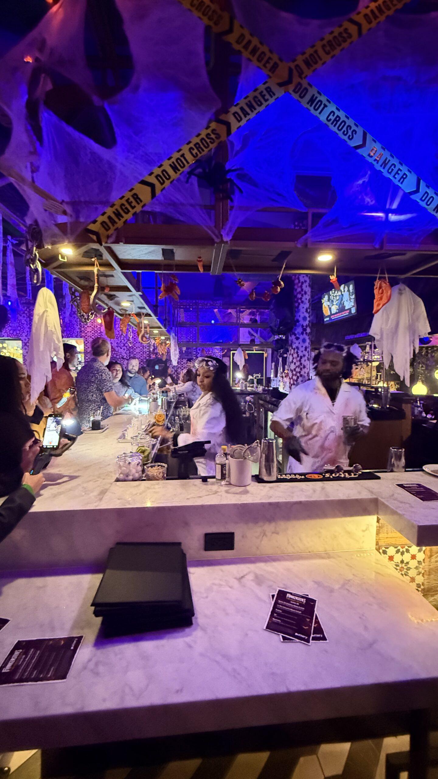 Halloween laboratory decorations and bartenders inside Frankenstein's Mad Scientist Cocktail Lab at Puttery