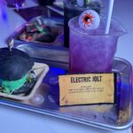 Purple and black Frankenstein-themed cocktails served in laboratory beakers at Puttery in Washington DC