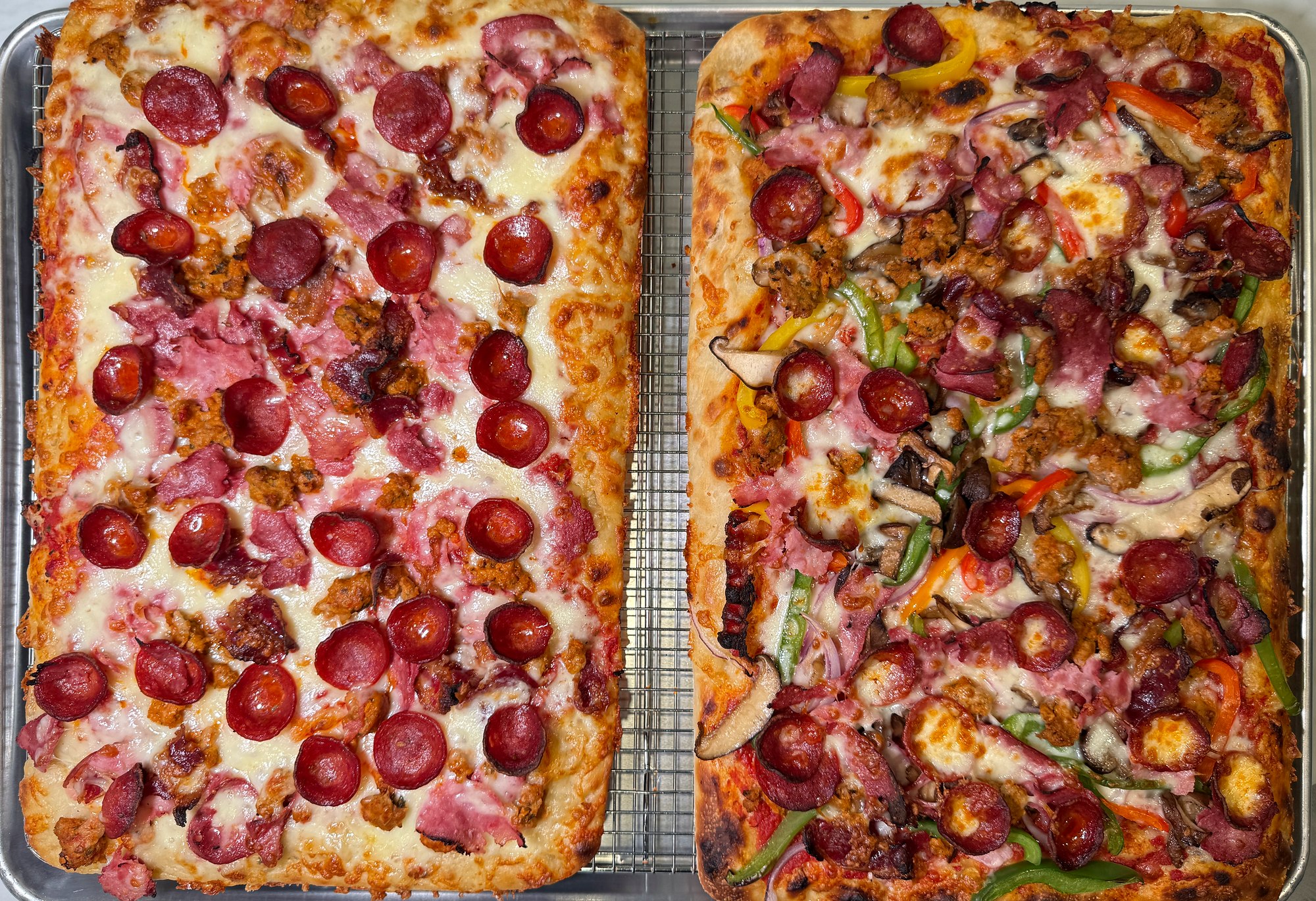 Two rectangular Sicilian-style pizzas at La Pâte on U Street