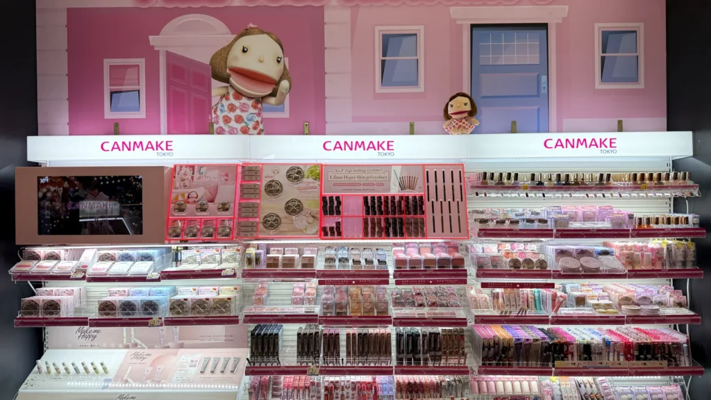 The CANMAKE beauty counter at Orange Pocket, with a Find Your Kawaii sign and rows of Japanese makeup