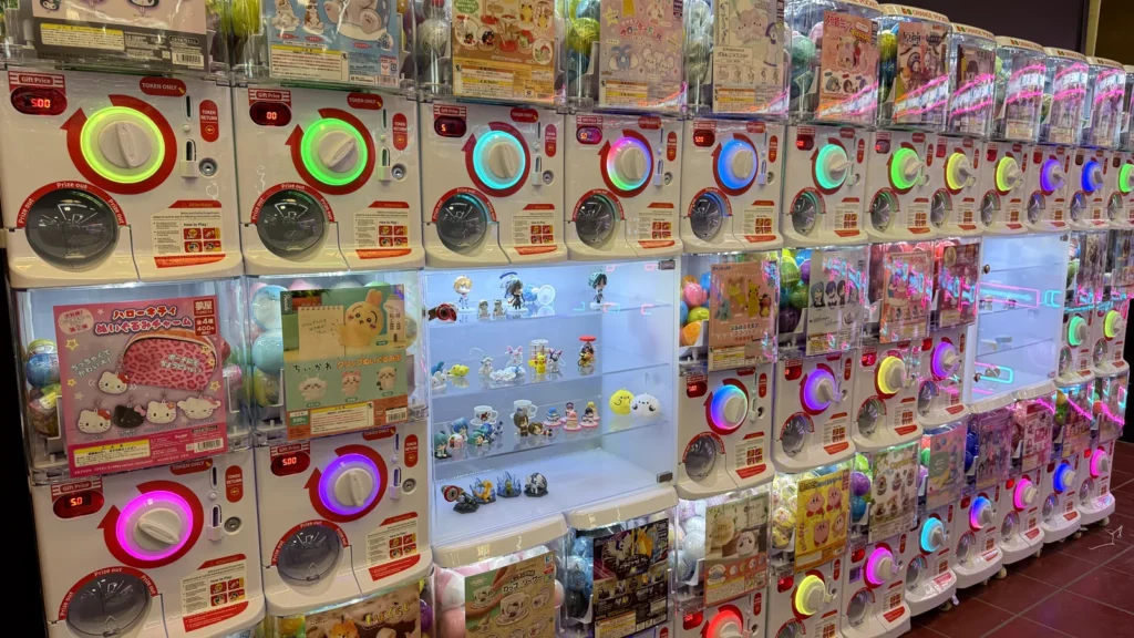 A wall of Bandai gashapon capsule-toy machines inside Orange Pocket in Gaithersburg