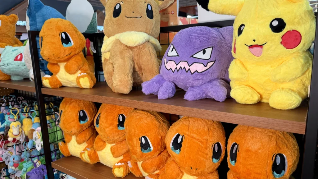Pikachu, Eevee, Charmander and Koffing Pokemon plush on shelves at Orange Pocket in Gaithersburg