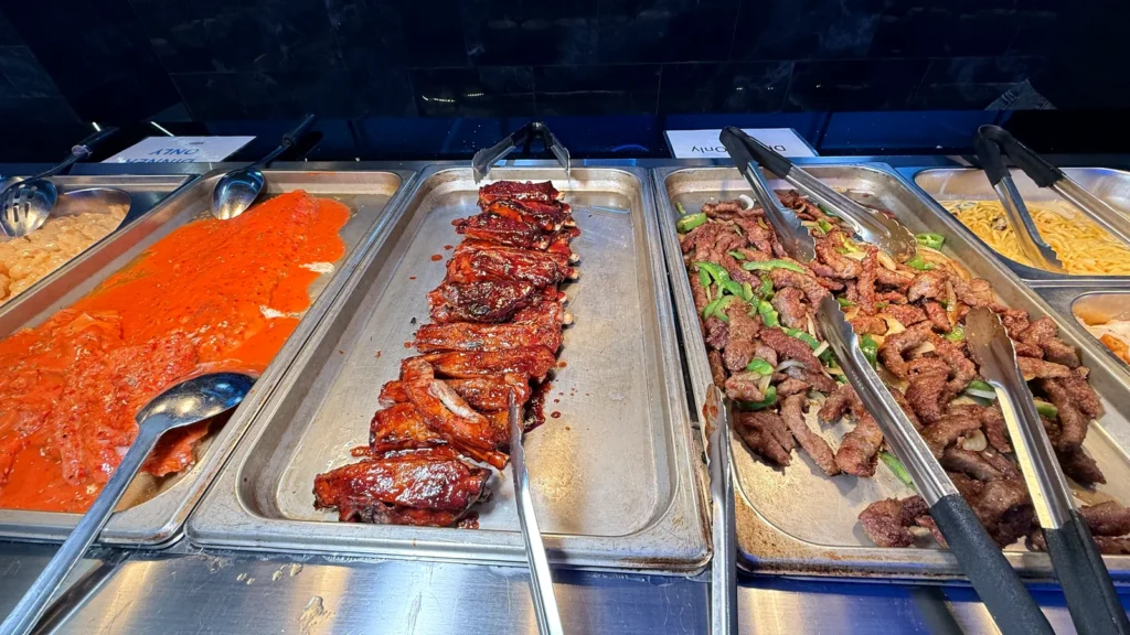 Barbecue ribs and beef with peppers on the hot line at Yami Buffet in Alexandria