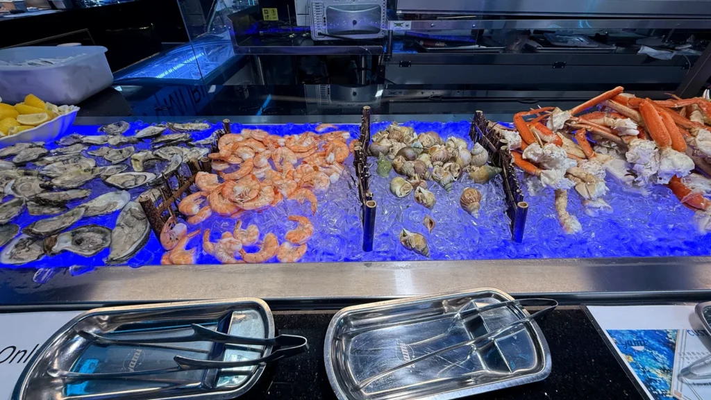 Oysters, shrimp and snow crab legs on ice at Yami Buffet’s dinner raw bar in Alexandria